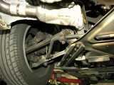 Closeup of the left rear wheel suspension.